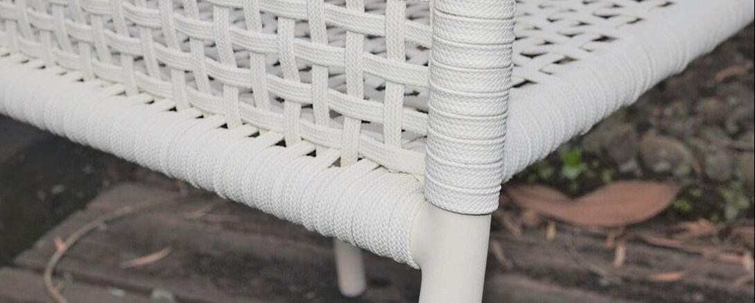 Detail of outdoor furniture of braided fibre and aluminium made in spain.