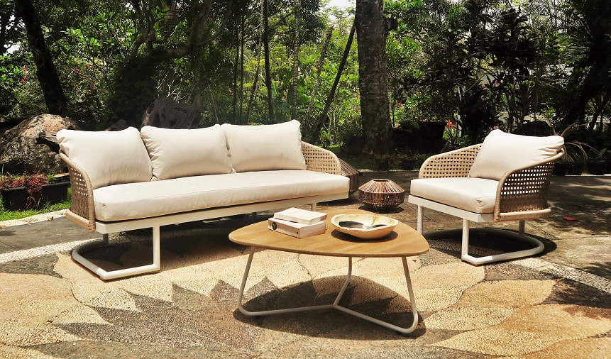 outdoor sofa and armchair in artificial fibre with wooden coffee table and UFO garden lamp