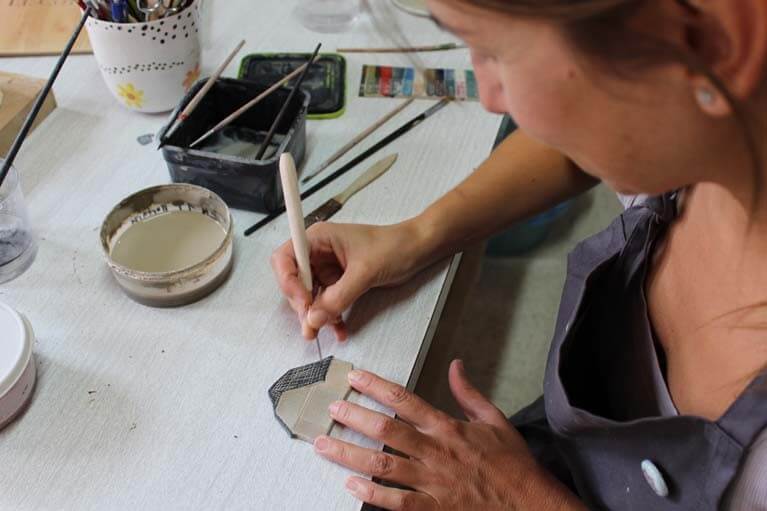 The artist Carme Vicens working in her studio