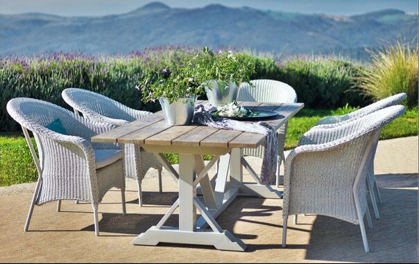 recatngular folding outdoor table with rattan armchairs on special offer in Marbella