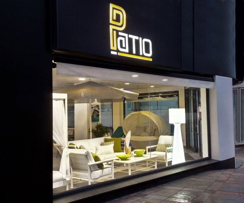 main facade of PATIO Top garden Furniture store in Fuengirola at night