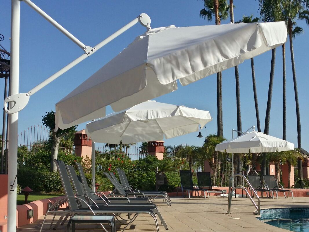 Cantilever parasols desgned and made in Spain with high quality standards for swimming pool areas