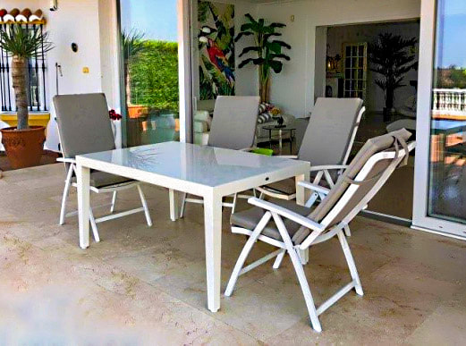 Picture of garden dining table with recliners in Malaga 
