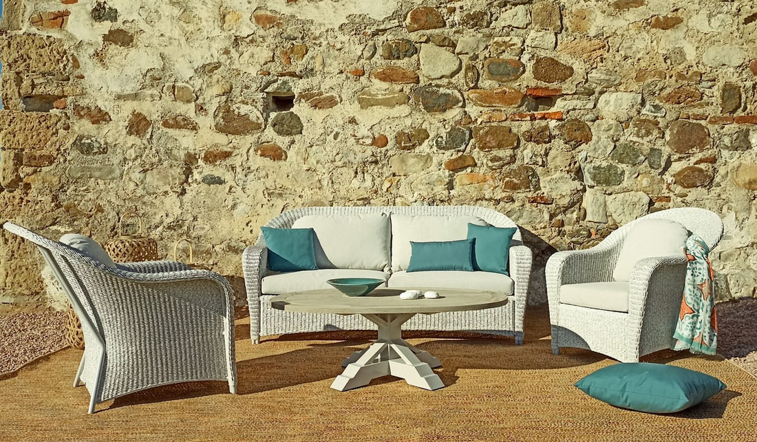 high end outdoor sofas in viro fibres with depp blue cushions and oval coffee table 