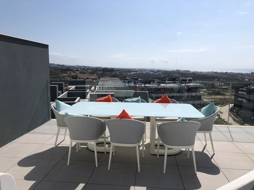 outdoor aluminium and glass dining set in penthouse near nueva andalucia from marbella