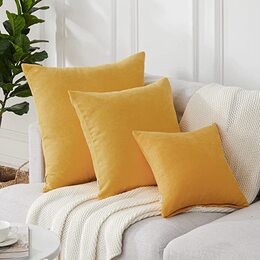 Decorative cushions in light shades for sofas and chairs