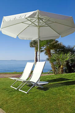 Round umbrella and hammocks in a beach near San Pedro in Marbella