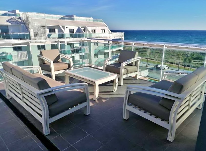 First beach line apartment in Mijas costa with aluminium sofas and tables